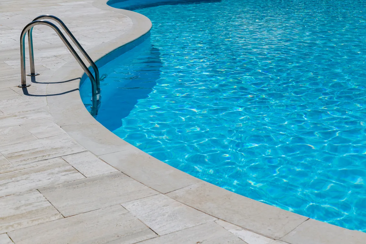 Pool edge and ladder